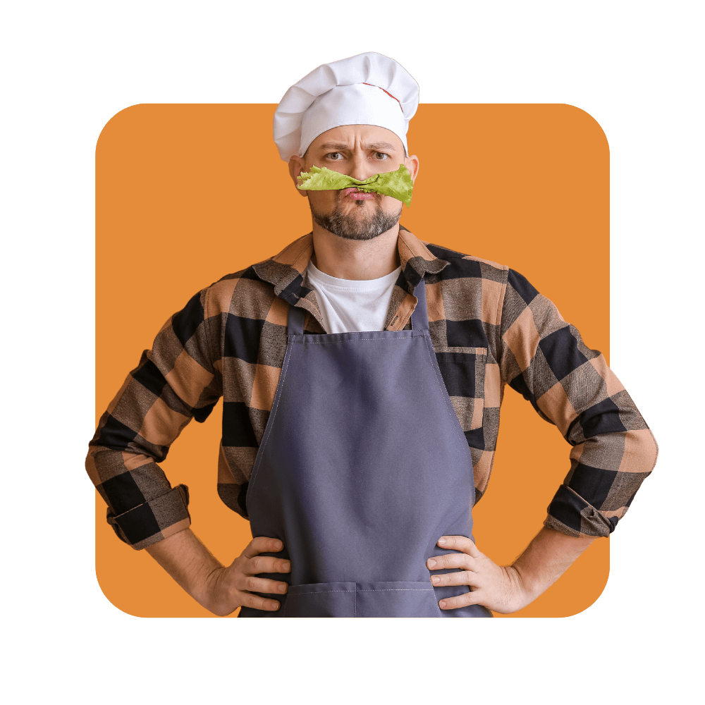 Homme avec chemise à carreaux et tablier avec de la salade entre le nez et la bouche sur fond marron - outils de fidélisation clients