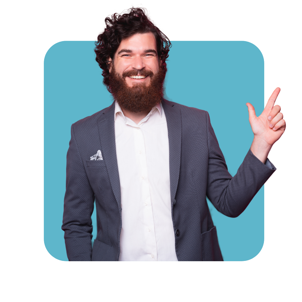 Homme brun barvu, en costume beu marine et chemise blanche main gauche levée - les soft skills